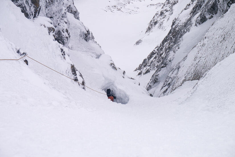 Andrew climbing out of the ice cave