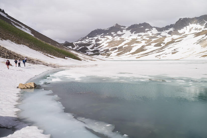 Walking past the frozen lake