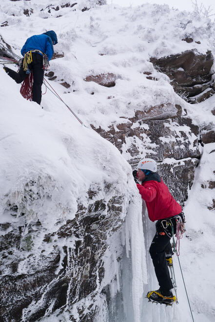 Zack climbing the ice pitch on Waterfall Gully