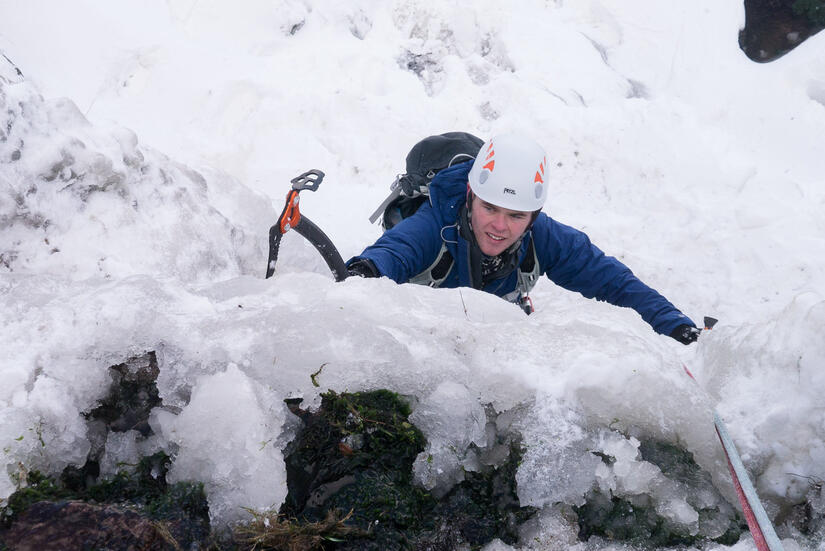 Zack climbing upto the main belay ledge