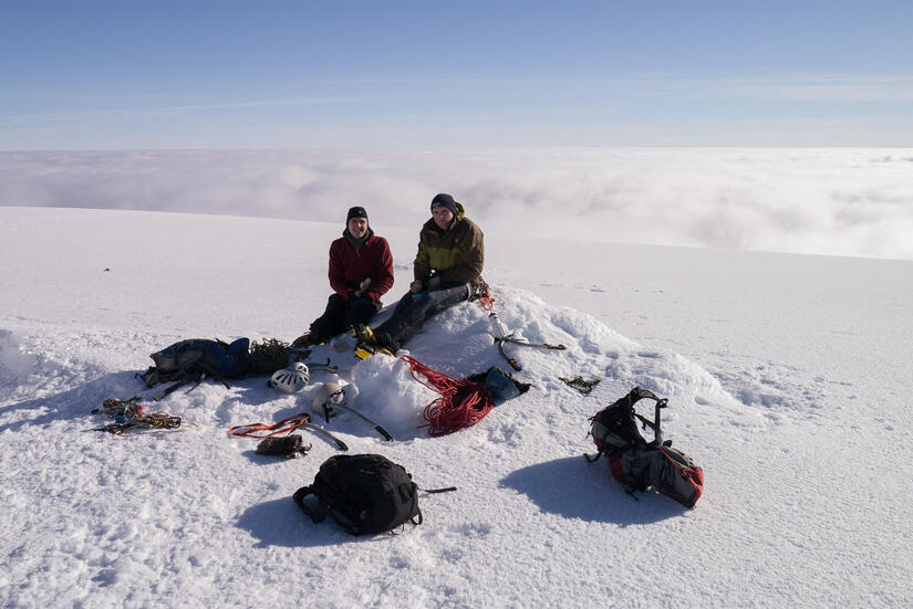 Enjoying lunch on a windless summit