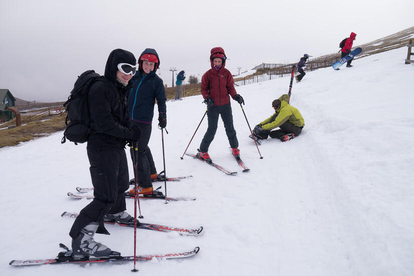 Putting skis on at the start of the day