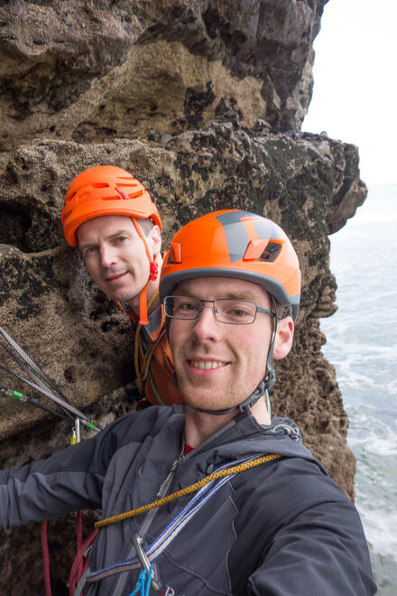 On the belay just above the sea